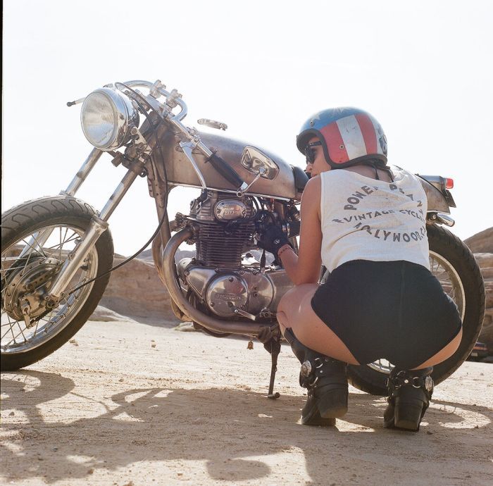 A playful frame from Girls on a motorcycle — online in Boston